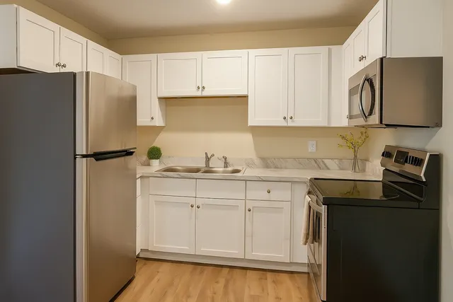a kitchen with a refrigerator and a sink
