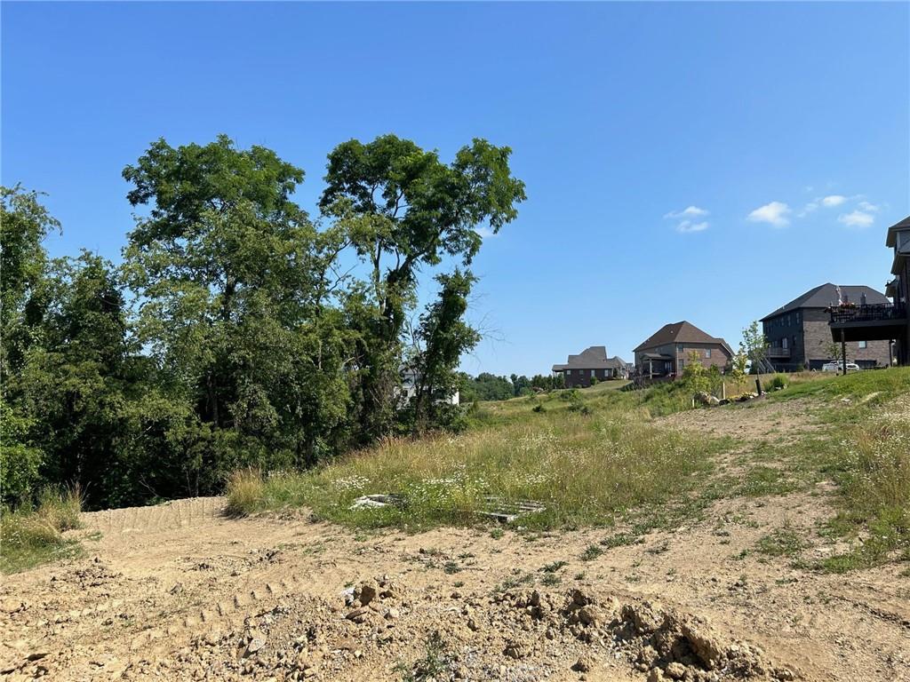 3055 Chestnut Ridge Drive Jefferson Hills, PA 15025 - Photo 6 of 10 a backyard of a house with lots of green space