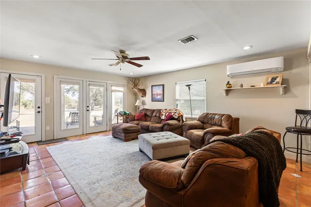 a living room with furniture and a large window