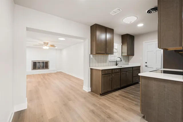 a large bathroom with a sink double vanity granite and a large mirror