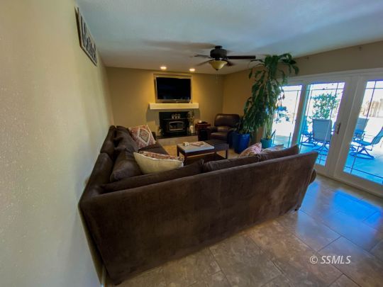 218 South Lilac Street Ridgecrest, CA 93555 - Photo 17 of 43 a living room with furniture and a flat screen tv