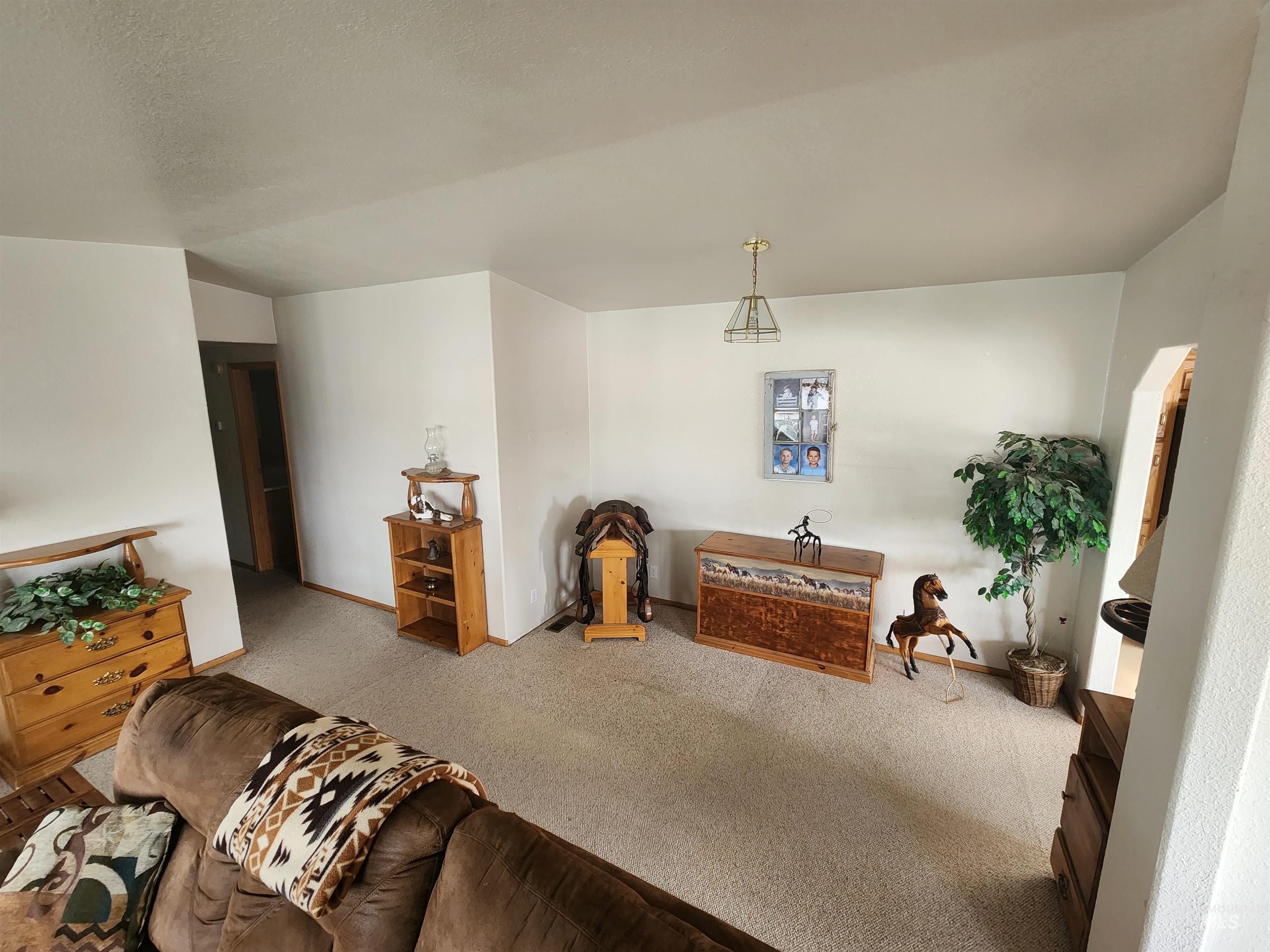 7001 South Robinson Road Melba, ID 83641 - Photo 27 of 38 Sheltered porch with decorative wood trim, horse shoe accents, and a plank wood floor