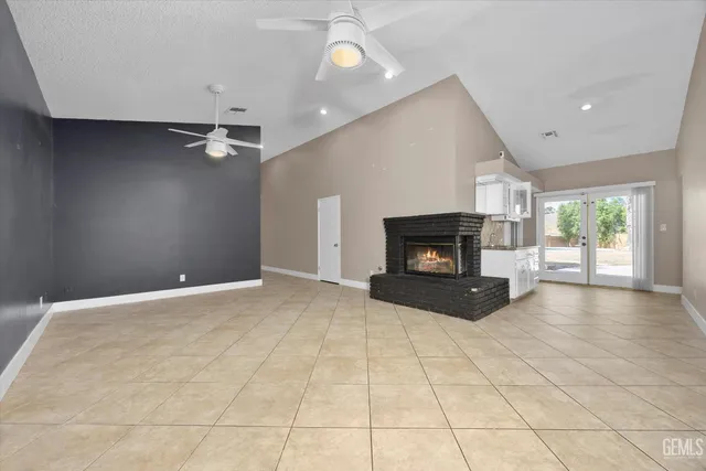 a view of an empty room with glass door