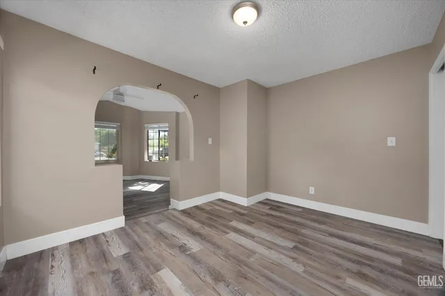 a view of a room with wooden floor