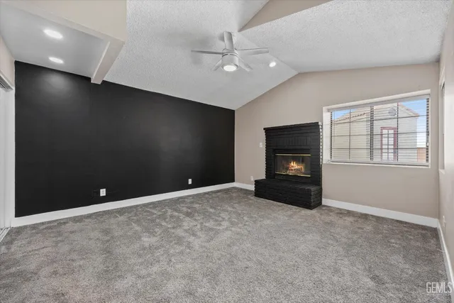 a bathroom with a granite countertop toilet a sink and bathtub
