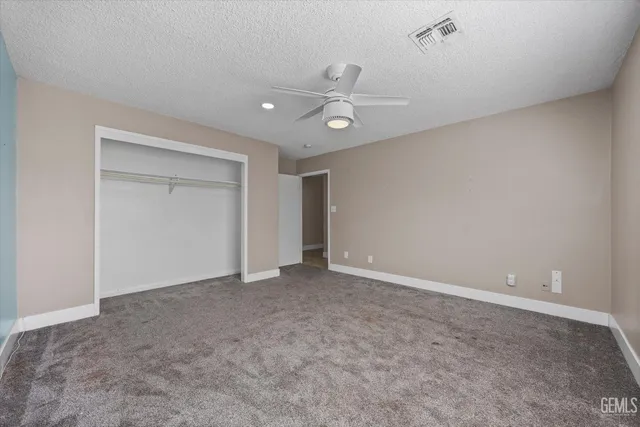 a view of a swimming pool with a yard