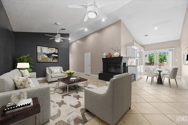 a view of a dining room with furniture and a potted plant