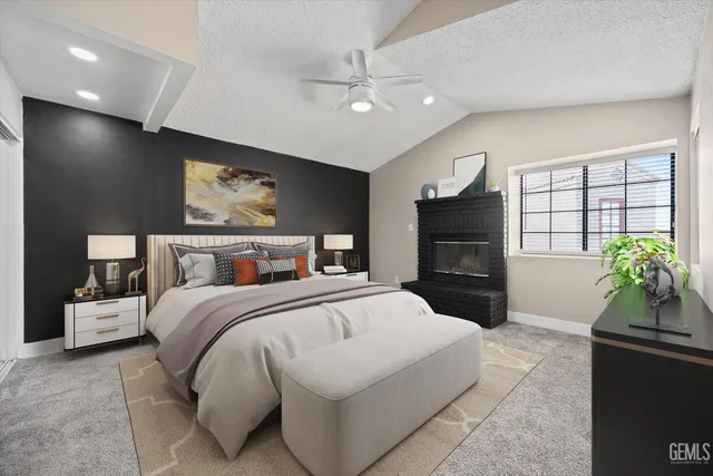 a bedroom with a bed and a potted plant