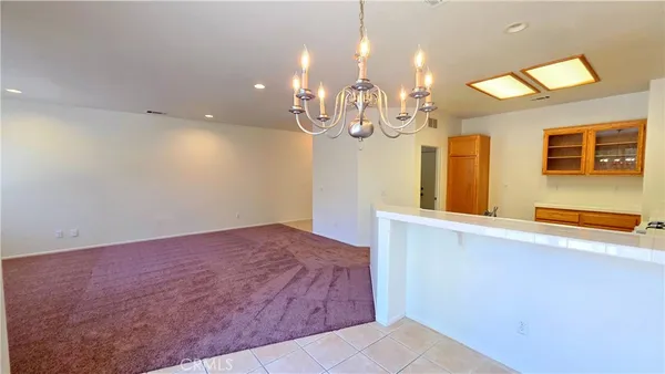 a view of kitchen and living room with a flat screen tv