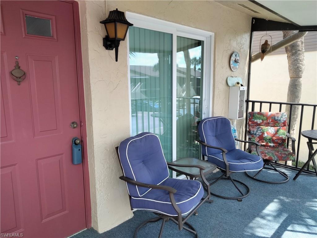 3535 Antarctic Circle, Unit 2302 Naples, FL 34112 - Photo 11 of 14 a living room with furniture and a window