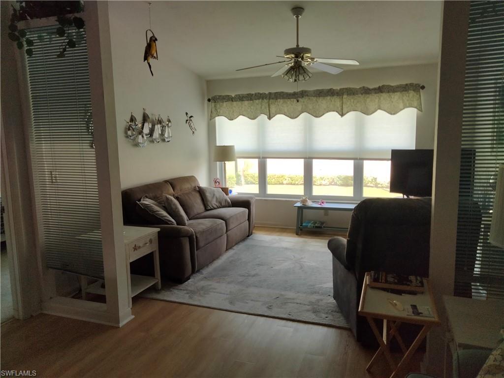 3535 Antarctic Circle, Unit 2302 Naples, FL 34112 - Photo 3 of 14 a living room with furniture and a window
