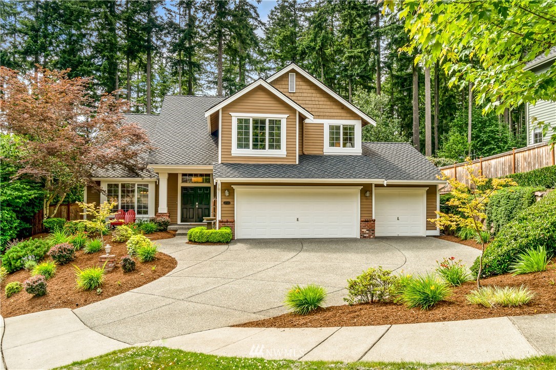 21518 30th Avenue Southeast Bothell, WA 98021 - Photo 1 of 40 a front view of a house with a yard and potted plants