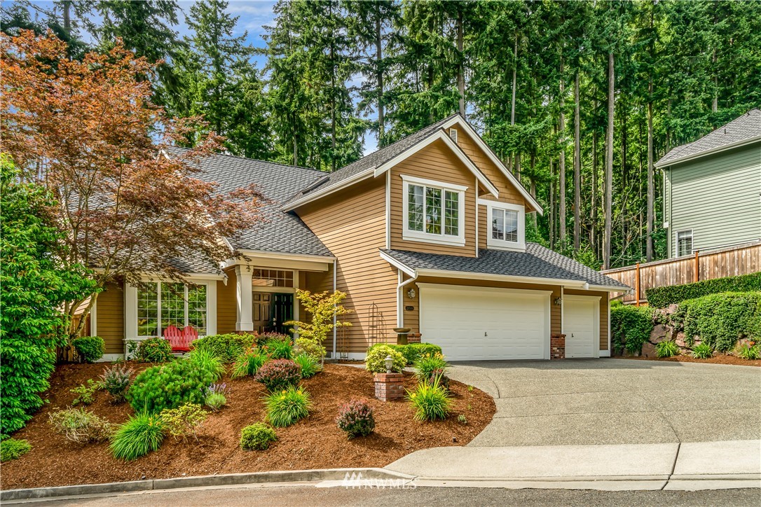 21518 30th Avenue Southeast Bothell, WA 98021 - Photo 3 of 40 a front view of house with garage and yard