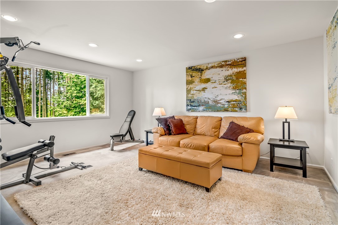 21518 30th Avenue Southeast Bothell, WA 98021 - Photo 29 of 40 a living room with furniture and a window