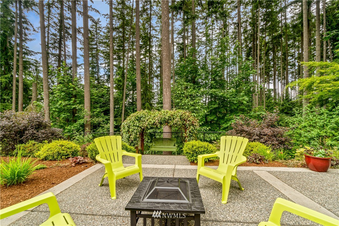 21518 30th Avenue Southeast Bothell, WA 98021 - Photo 34 of 40 a view of a chair and table in backyard