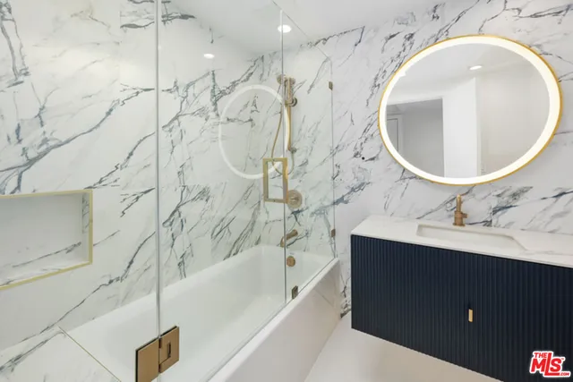 a bathroom with a bathtub and a sink