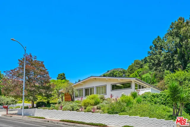 a house view with a garden space