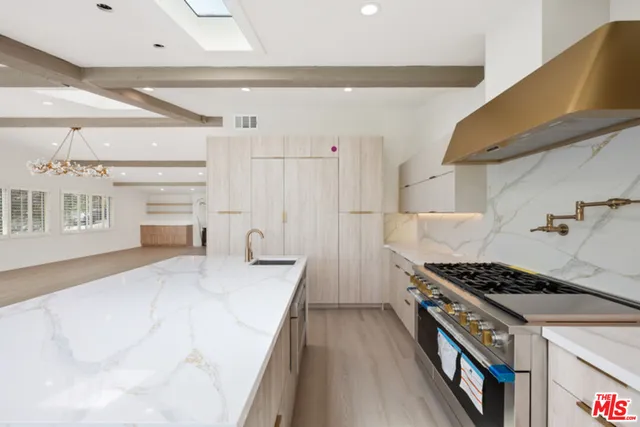 a kitchen with a stove and a refrigerator
