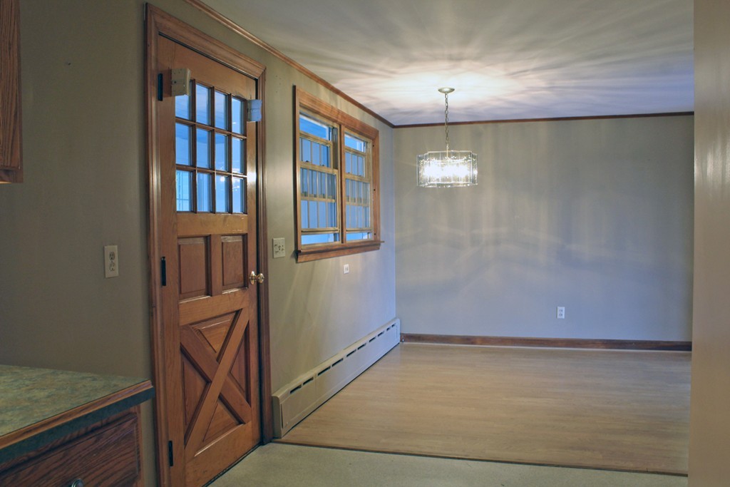 168 Chestnut Plain Road Whately, MA 01093 - Photo 5 of 28 an empty room with chandelier fan and windows