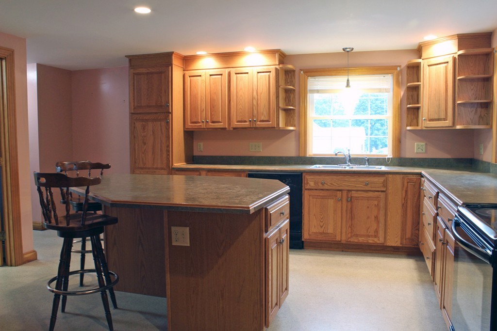 168 Chestnut Plain Road Whately, MA 01093 - Photo 8 of 28 a kitchen with a sink stove and cabinets