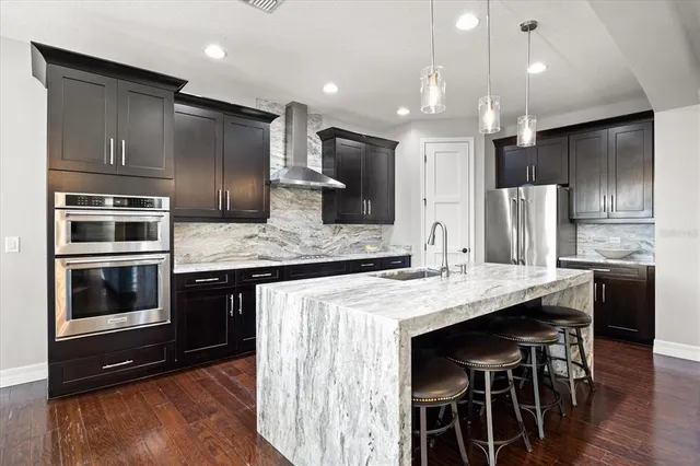 a living room with fireplace furniture and a flat screen tv