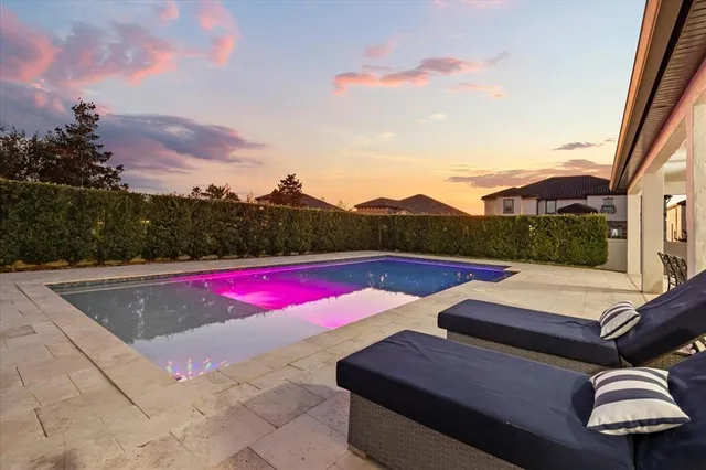 a view of a terrace with couches and lounge chair