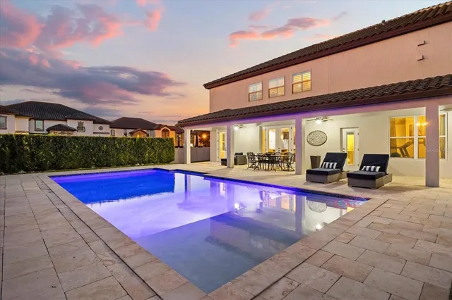 a view of a terrace with couches and sky view
