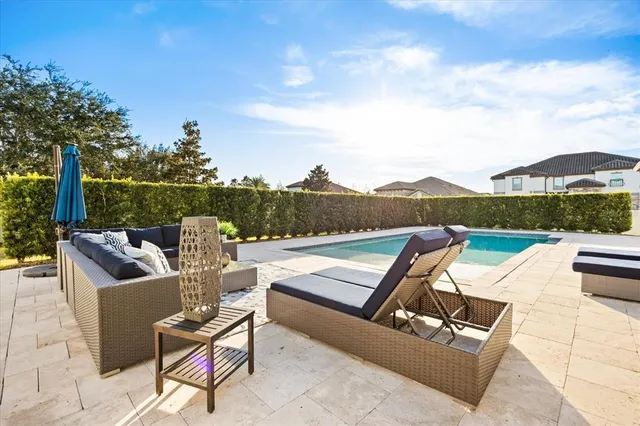 a view of a swimming pool and an outdoor space