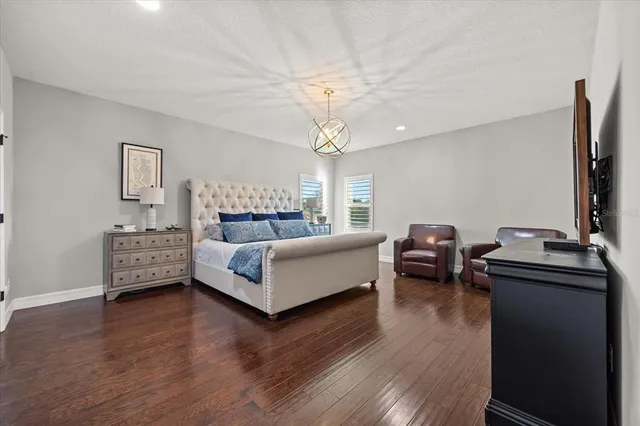 a bathroom with a tub a sink and a window
