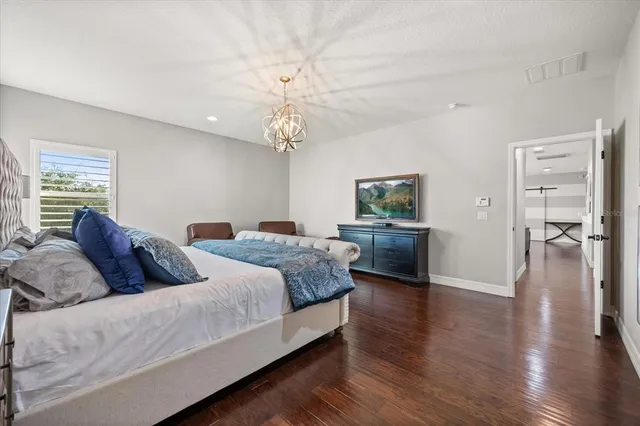a bathroom with a granite countertop sink mirror and shower