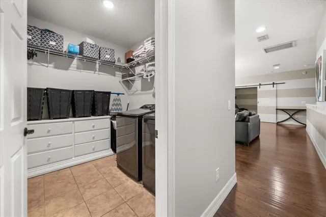 a view of an entryway with wooden floor