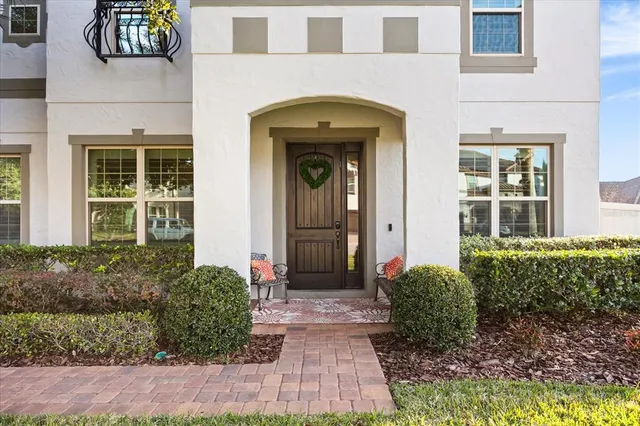 a front view of a house with garden