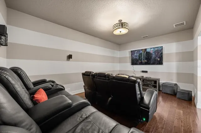 a view of swimming pool with red chair