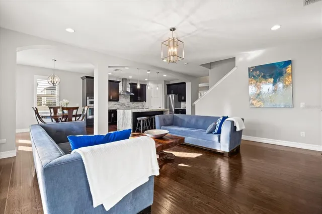 a kitchen with stainless steel appliances granite countertop sink stove top oven and cabinets