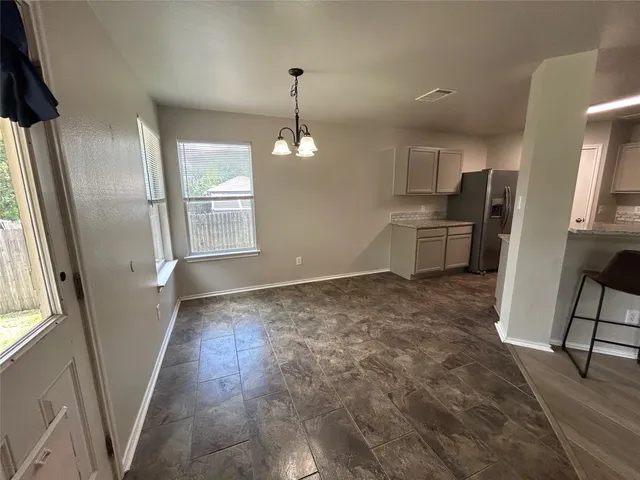 a view of a kitchen with furniture and a window