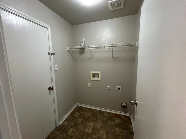 a bathroom with a glass door shower a toilet and a sink