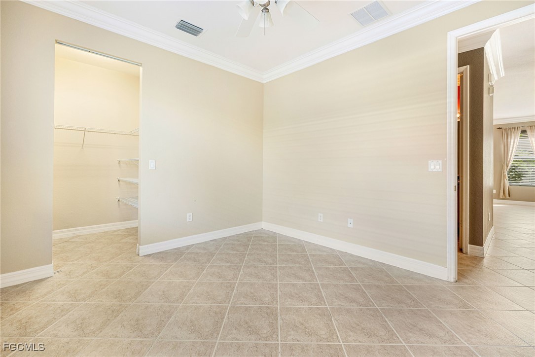 11196 Sand Pine Court Fort Myers, FL 33913 - Photo 24 of 49 an empty room with windows and entrance