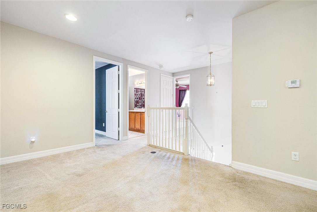 11196 Sand Pine Court Fort Myers, FL 33913 - Photo 27 of 49 an empty room with wooden floor and windows