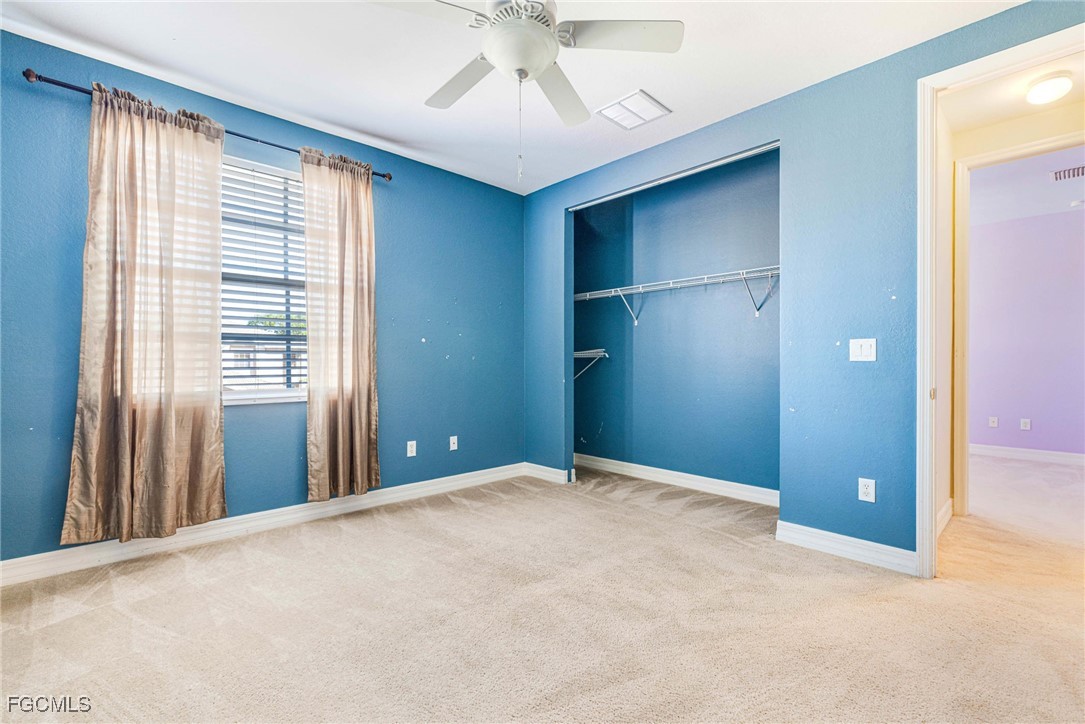 11196 Sand Pine Court Fort Myers, FL 33913 - Photo 36 of 49 an empty room with windows and closet