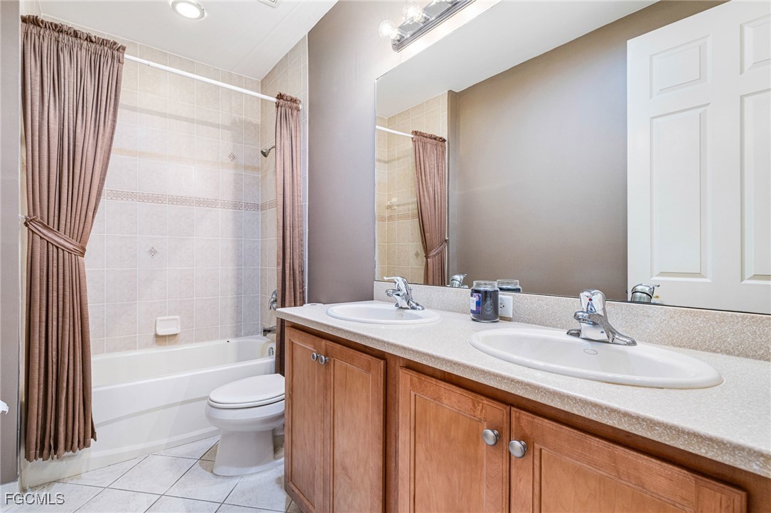 11196 Sand Pine Court Fort Myers, FL 33913 - Photo 37 of 49 a bathroom with a granite countertop sink toilet and shower