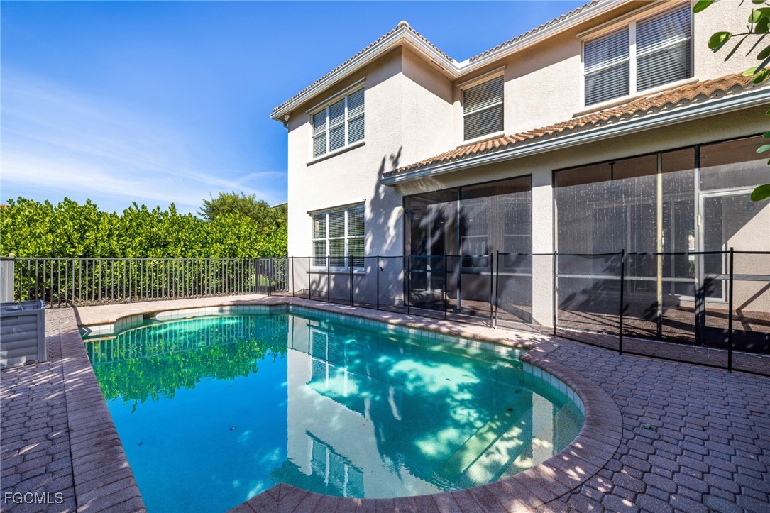 11196 Sand Pine Court Fort Myers, FL 33913 - Photo 40 of 49 a view of a house with pool fire pit and chairs in patio