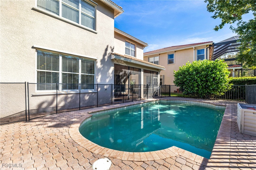 11196 Sand Pine Court Fort Myers, FL 33913 - Photo 41 of 49 a view of a house with pool fire pit and chairs in patio