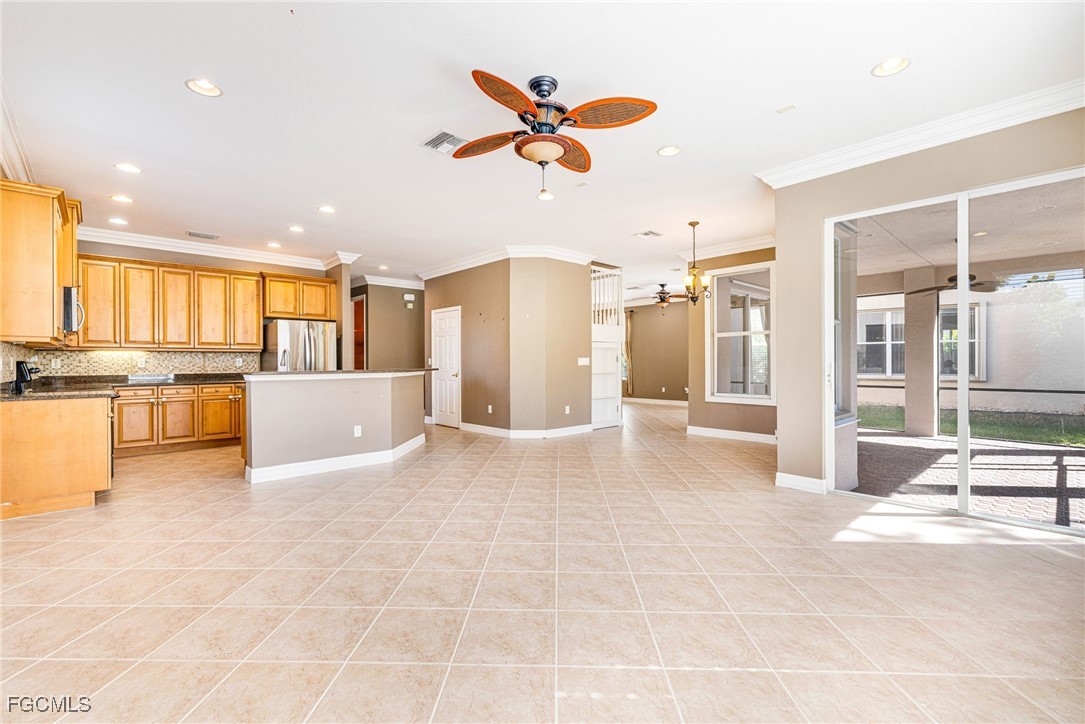 11196 Sand Pine Court Fort Myers, FL 33913 - Photo 5 of 49 a view of a kitchen with a sink and a refrigerator