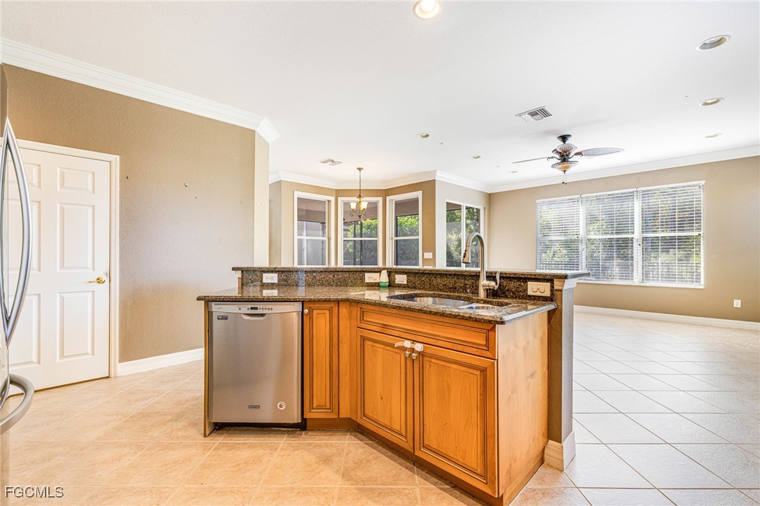 11196 Sand Pine Court Fort Myers, FL 33913 - Photo 8 of 49 a kitchen with stainless steel appliances granite countertop a stove and a sink
