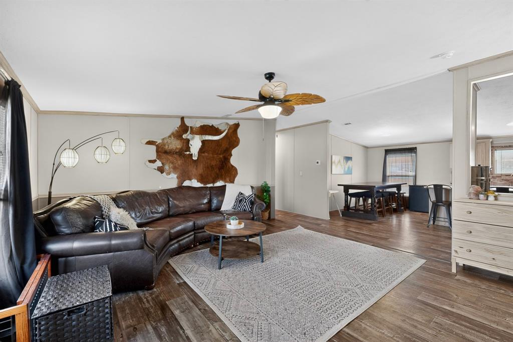115 Vinall Circle Decatur, TX 76234 - Photo 6 of 23 a living room with furniture and wooden floor