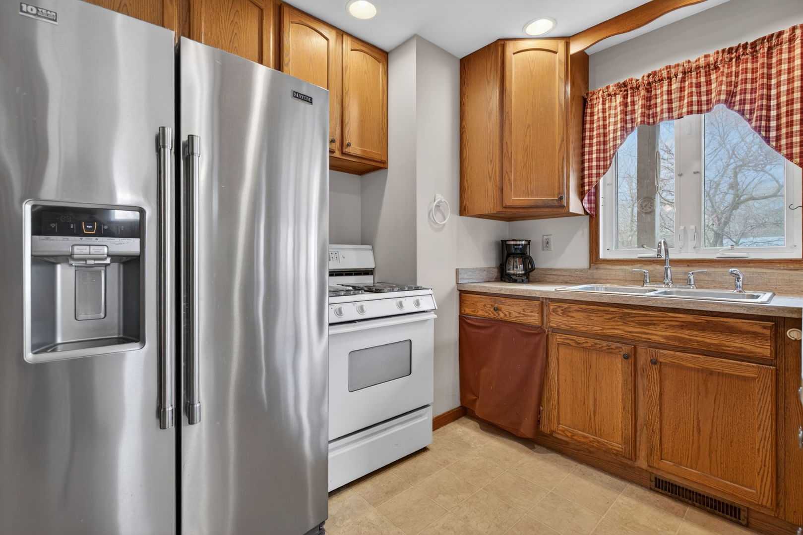 1 Largemouth Lane Wilmington, IL 60481 - Photo 14 of 47 a kitchen with stainless steel appliances a refrigerator sink and cabinets