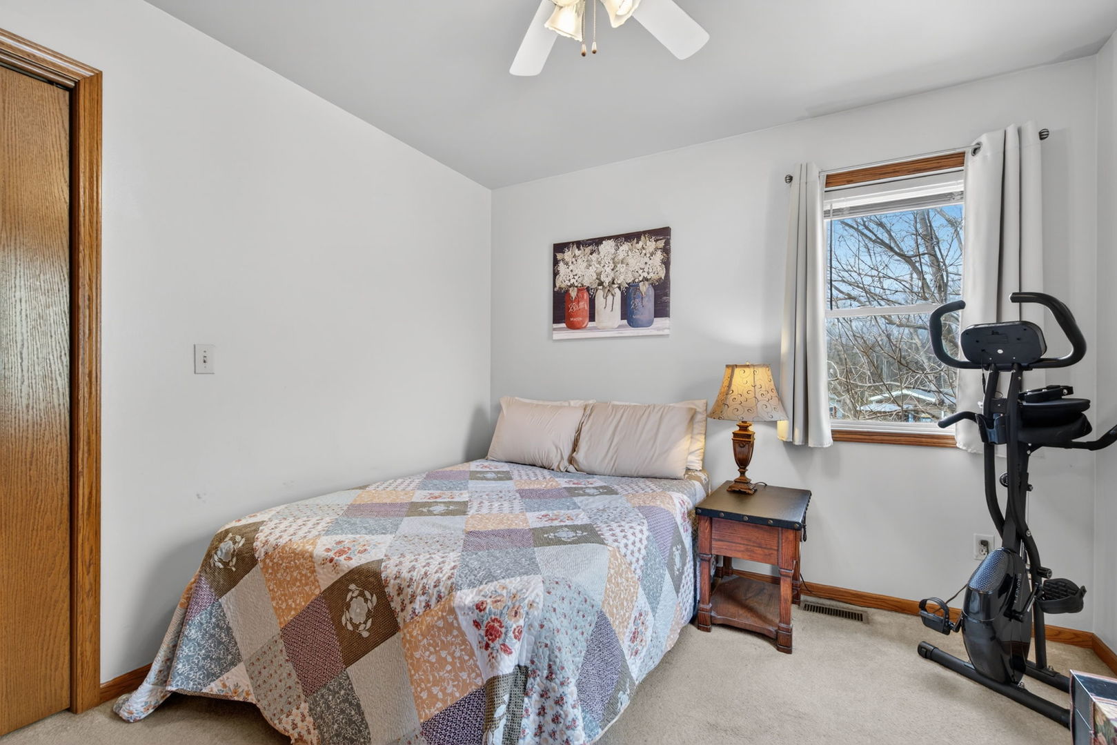 1 Largemouth Lane Wilmington, IL 60481 - Photo 20 of 47 a bedroom with a bed and a chandelier