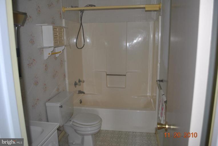 17916 Marshall Mill Road Hampstead, MD 21074 - Photo 7 of 13 a bathroom with a shower a toilet and a shower