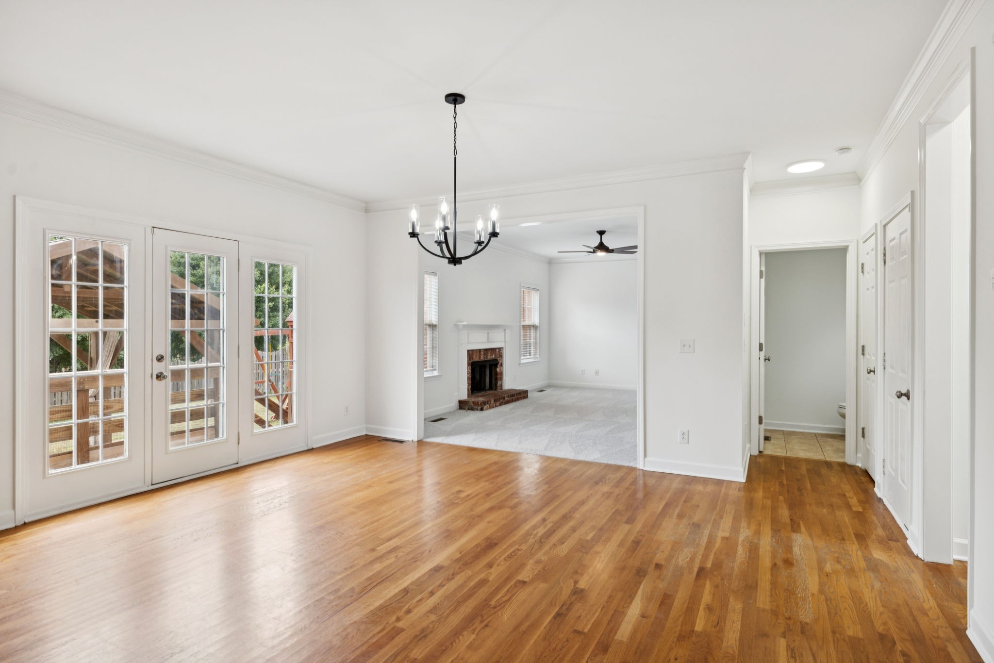 2015 Keene Circle Spring Hill, TN 37174 - Photo 12 of 37 a view of a livingroom with wooden floor staircase and a kitchen space