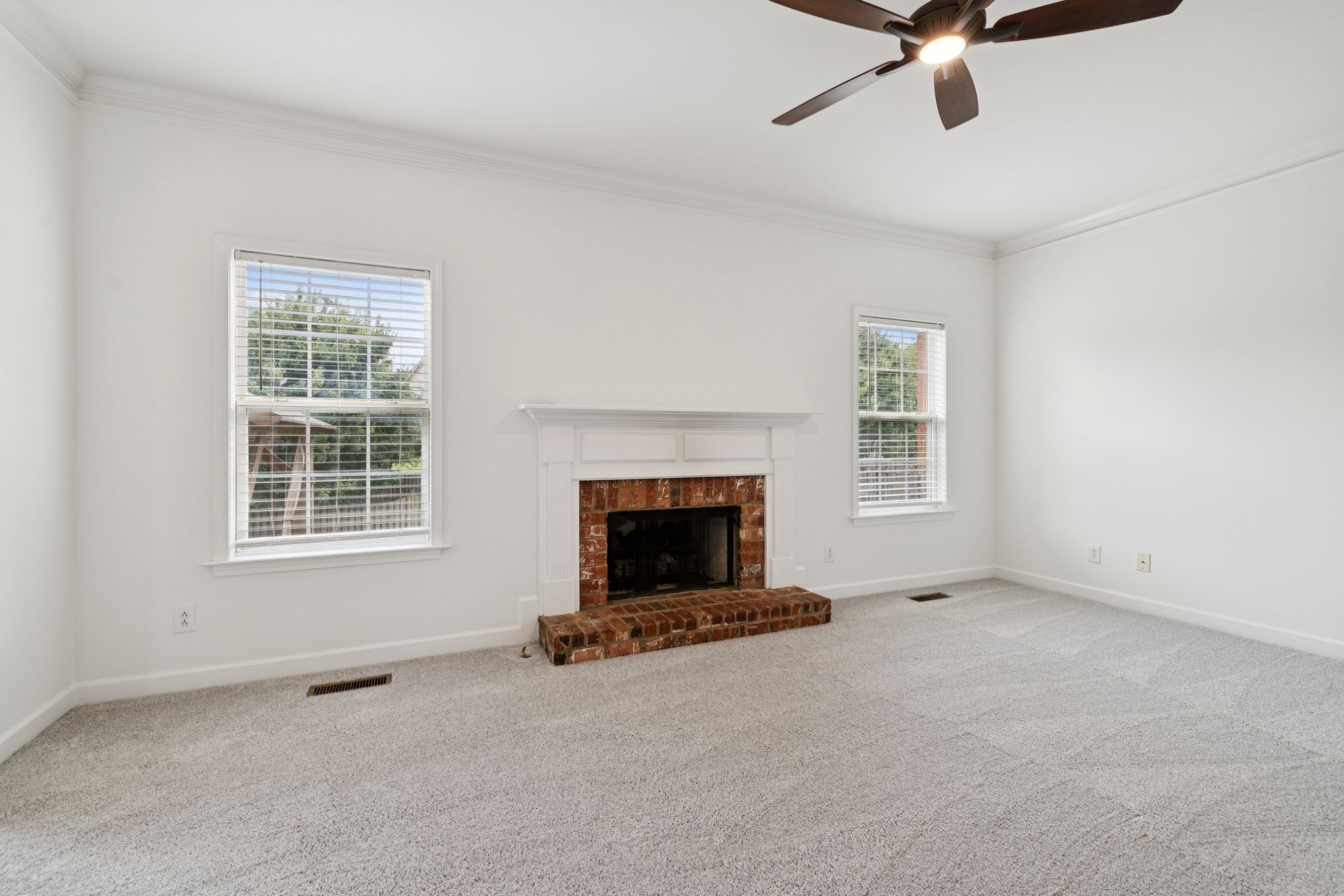 2015 Keene Circle Spring Hill, TN 37174 - Photo 13 of 37 a living room with a fireplace and a window